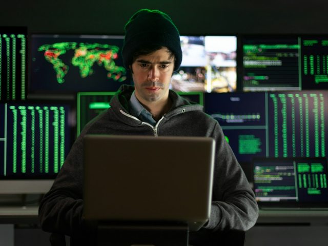 Hacker using laptop breaks into government data servers infects system with virus.